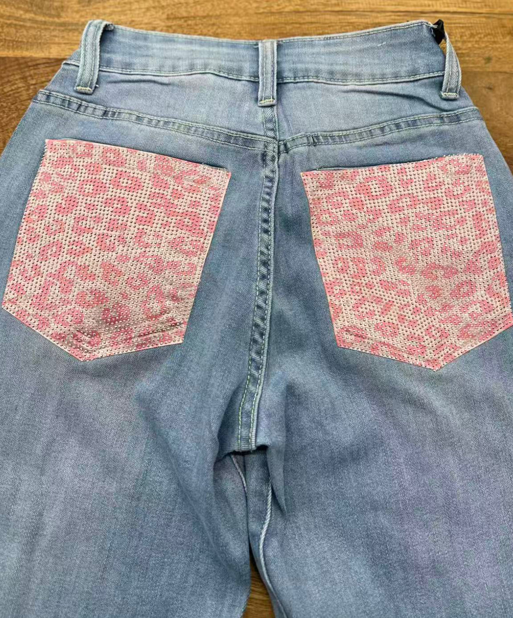 Jeans tasca strass maculato rosa